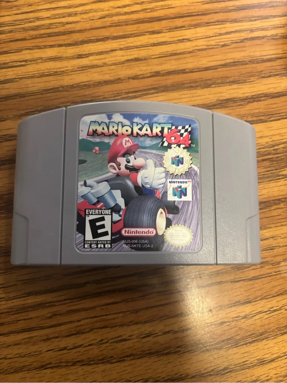 Nintendo N64 Console with Gray Mario Kart 64 Cartridge and Black Power Adapter